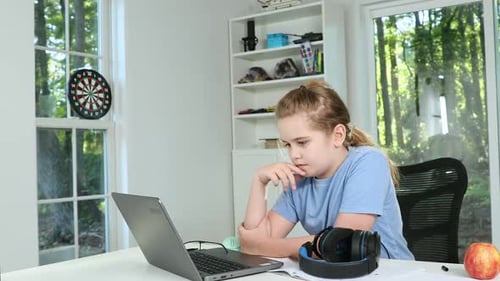Kid Studying at Desk Child Doing Homework on Laptop Boy Doing Home Education Kid Learning on Laptop