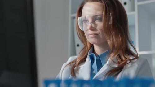 Female Scientist Working in Modern Laboratory