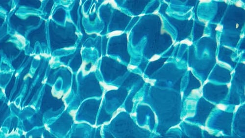 closeup of blue turquoise pool water ripple texture