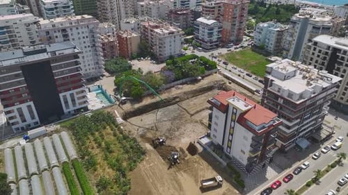 Aerial View Construction Begins First Concrete and Heavy Machinery on Site