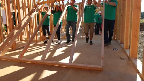Volunteers Constructing Building Interior During Daytime