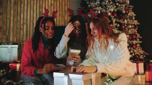Women Friends Wrapping Christmas Gifts Together