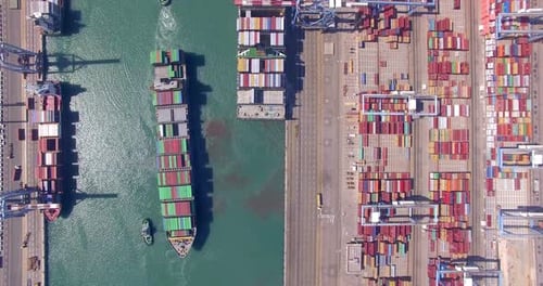 Commercial port with container ships during loading and unloading