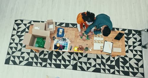 Teamwork, delivery and fashion designer people boxing a product in office for courier shipping