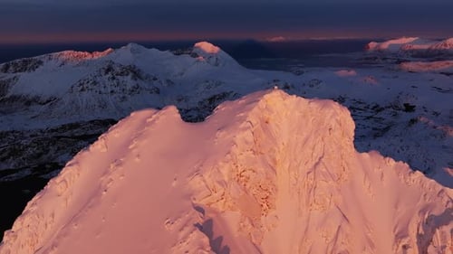 Drone View of Snowy Mountain Range Silhouette Sunrise Aerial View Landscape Dawn Sunlight
