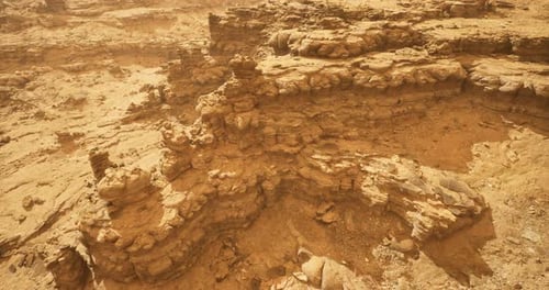 Stunning Rock Formations in a Barren Desert Landscape Under Clear Sky