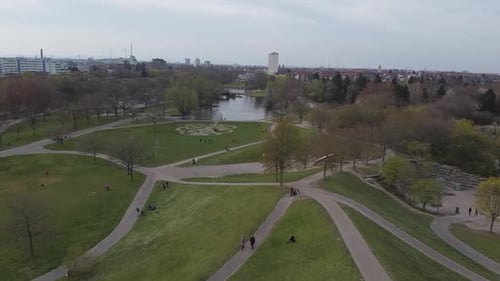 Aerial footage flying over a nicely designed park and recreation area in western Europe on an overca