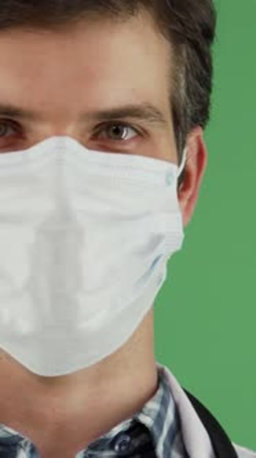 Confident Male Doctor in a Medical Mask Exuding Joy and Professionalism