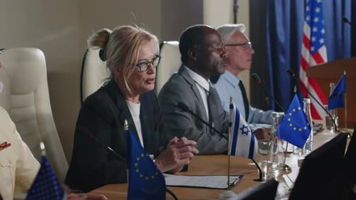 Diverse Group at Formal Meeting Around Conference Table