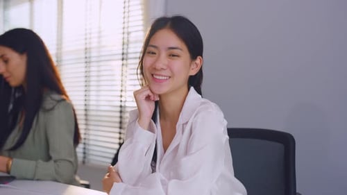 Portrait of Asian beautiful business woman smile while working in office.