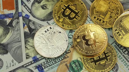 Gold and Silver Bitcoins on Hundred Dollar Bills