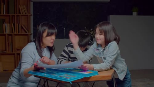 Family Drawing Together at Home