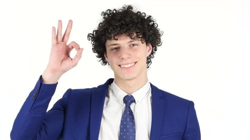 Young Adult Gives OK Hand Gesture with Smile