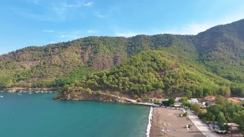 Camera Slowly Pans to the Right Revealing a Beautiful Mediterranean Coastline with Turquoise Waters