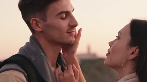Romantic Couple Kissing Tenderly at Sunset