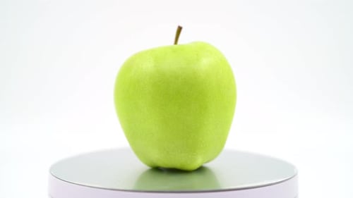 Green apple close up on white background isolated 4K