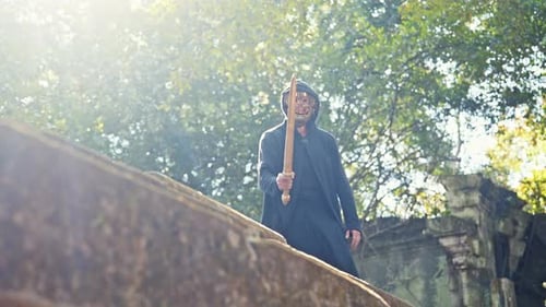 Masked Figure Practicing Sword Fighting in Forest Ruins
