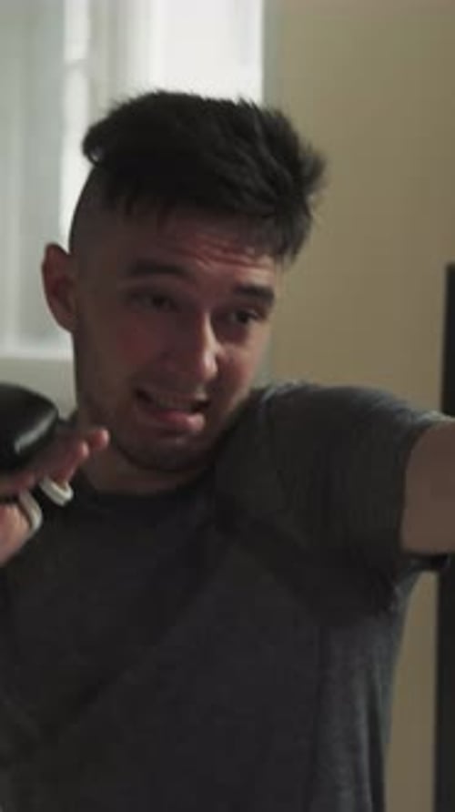 Boxer Blocks Face From Punches During Sparring in Gym