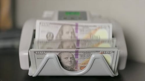 Automated Machine Counts Stacks of Dollar Bills