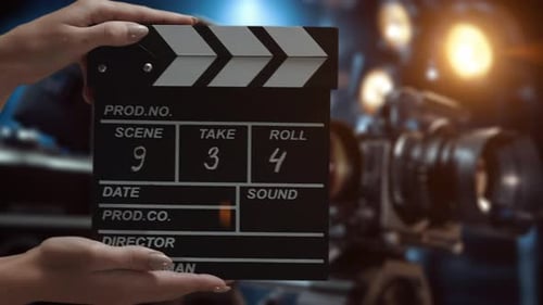 Human Hands are Using a Clapperboard on Set Beginning of Scene in Film or TV Television Production
