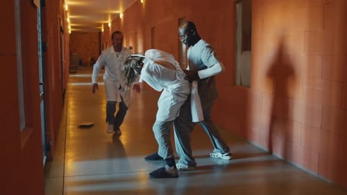 Hospital Restraint Scene in Brightly Lit Hallway
