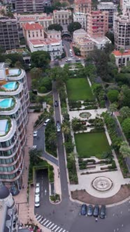 Vertical Drone Shot of Downtown Monte Carlo, Monaco. Famous Square, Park and Expensive Upscale Build