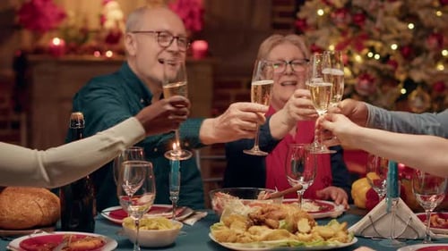 Cheerful Close Relatives Enjoying Winter Holiday Together While Drinking Sparkling Wine