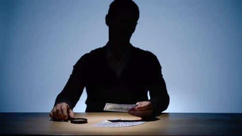 Shadowy Figure Inspecting Money with Magnifying Glass
