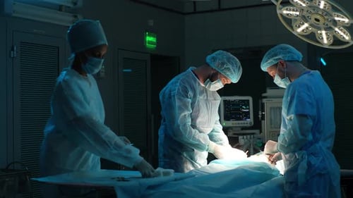 Medical Staff Performing Surgery in Operating Room
