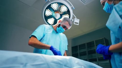 Surgeons Performing Operation in Hospital Operating Room
