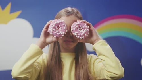 Teenager Sporting Pink Confectionery Goggles Creating Cheerful Whimsical Atmosphere with Sweet