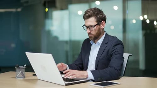 Difficulties are problem working with software on a laptop business man employee entrepreneur office