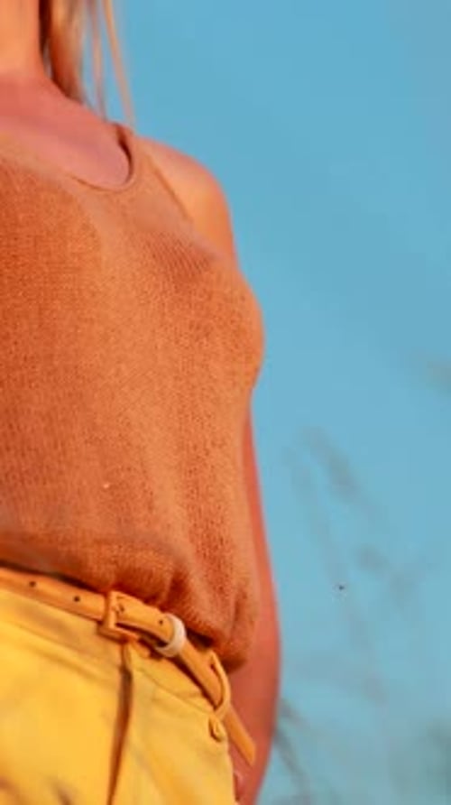 Young Woman Poses in Golden Sunlight