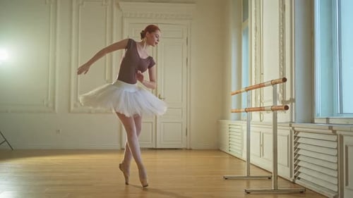 Graceful Woman Ballet Dancing in Studio Practice