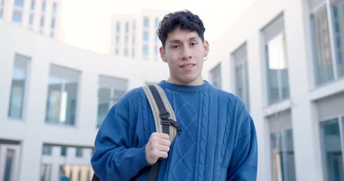Cheerful Young Man with Backpack at College Campus