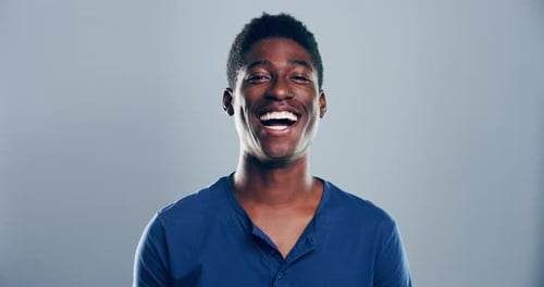 Smiling Man Gives Thumbs Up Gesture