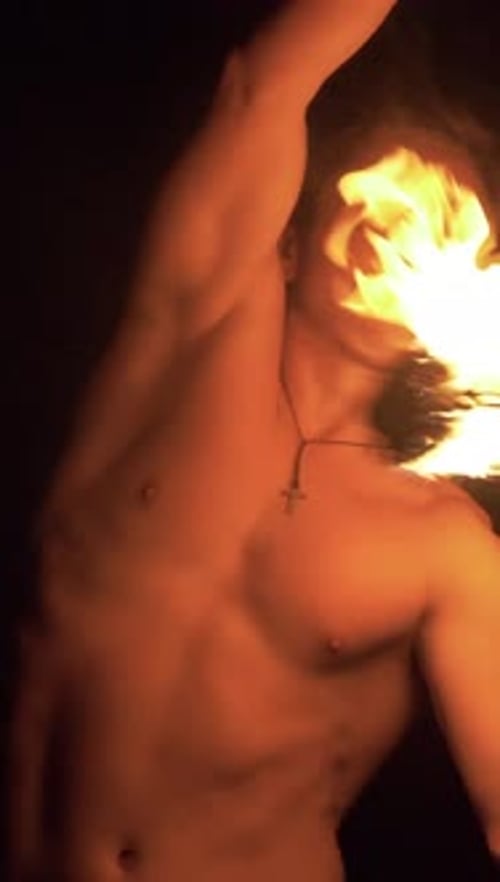 Man Fire Spinning in the Dark