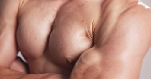 Body, muscle and skin of man in studio with fitness, strength and bodybuilder closeup