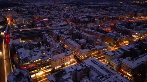 Berlin Steglitz shopping street in Snow at winter evening. Spectacular aerial view drone
