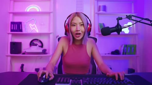 Excited Woman Wins While Gaming and Streaming