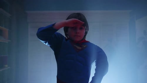 Child Dressed as Superhero Looking at Something