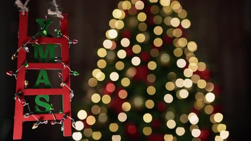 Christmas Decoration Ladder on Blurred Tree Background