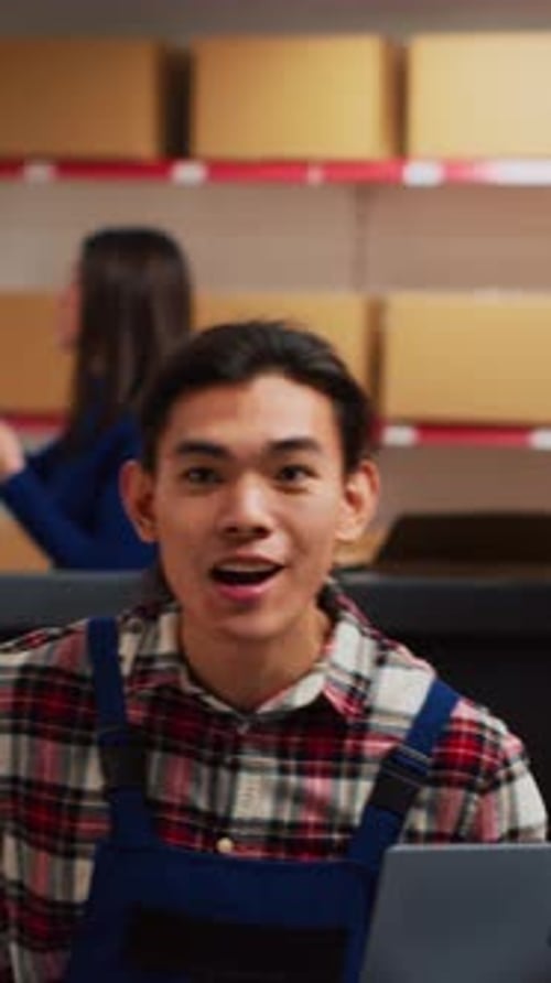 Warehouse Employee Talking at Shipping Station