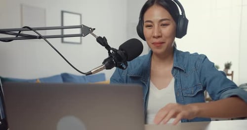 Woman Podcasting at Home with Laptop and Microphone