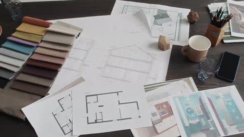 Overhead View of Design Workspace on Wooden Table