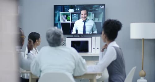 Diverse Team Video Conferencing in Modern Office