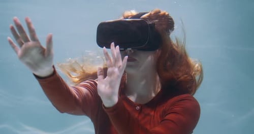 Woman Using Virtual Reality Headset Underwater