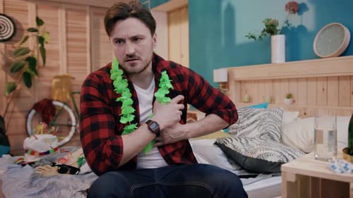 A Young Man in a Casual Setting is Openly Expressing His Discomfort During a Gathering