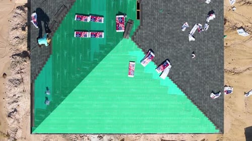 House Roof Covering with Asphalt Shingles Construction Crew Working on Real Estate Development