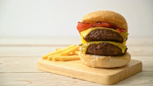 Juicy Double Cheeseburger with French Fries on Platter